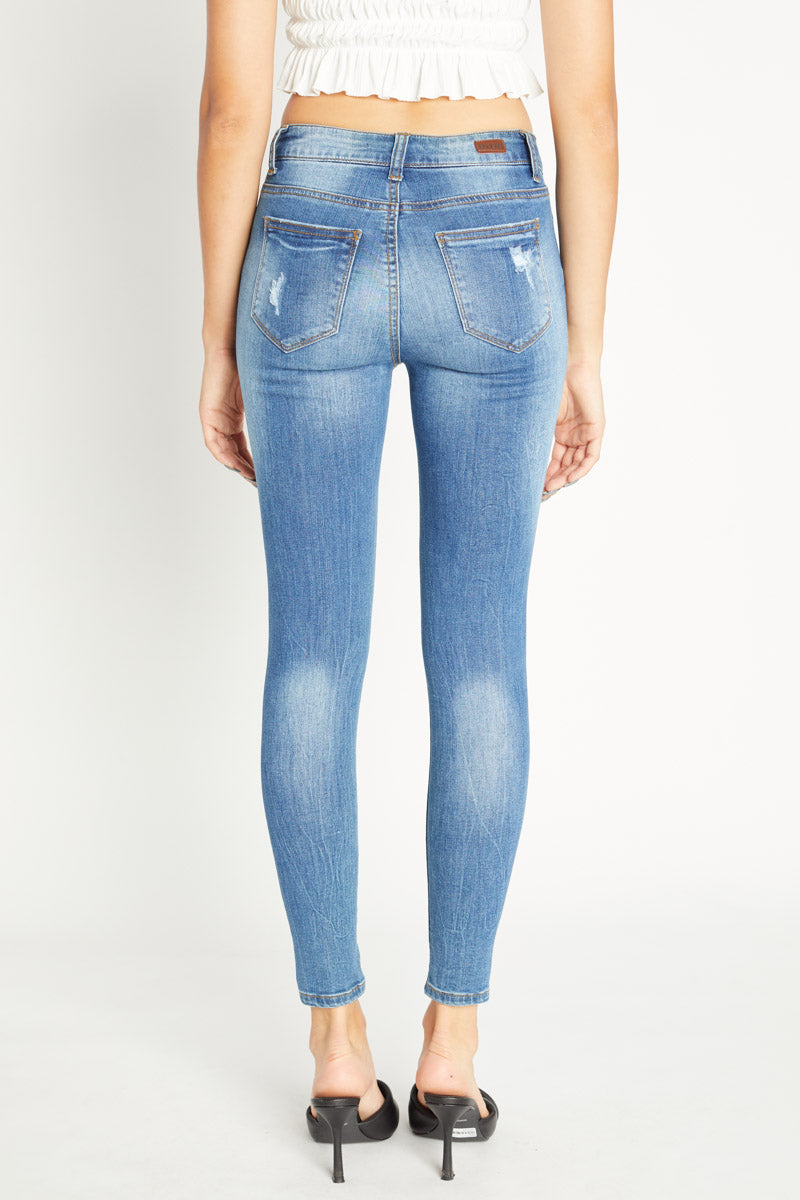 Distressed Mid Rise Ankle Skinny Jeans
