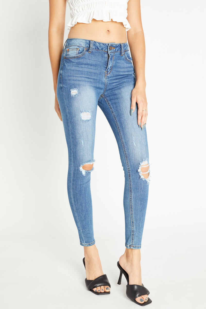Distressed Mid Rise Ankle Skinny Jeans