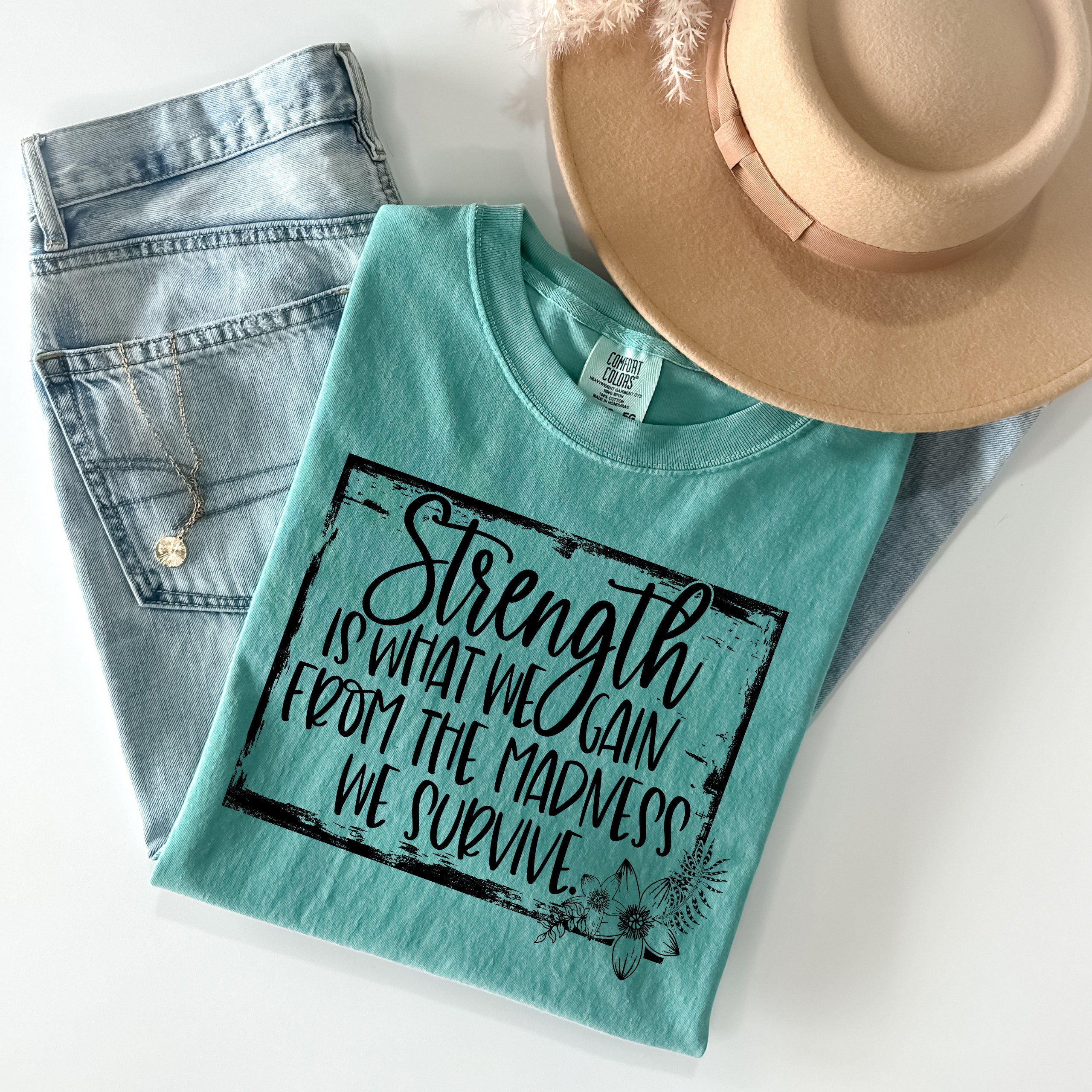 Strength is What We Gain Graphic Tee