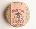 North Pole Book Club Graphic Tee