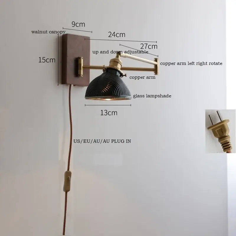 Adjustable brass wall sconce with ribbed glass shade bedroom light