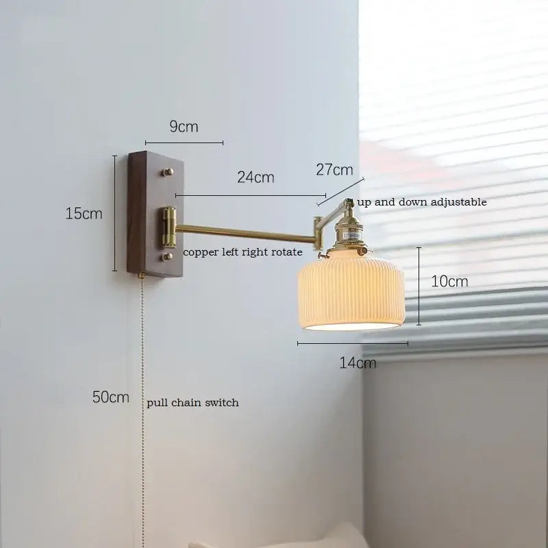 Adjustable brass wall sconce with ribbed glass shade bedroom light