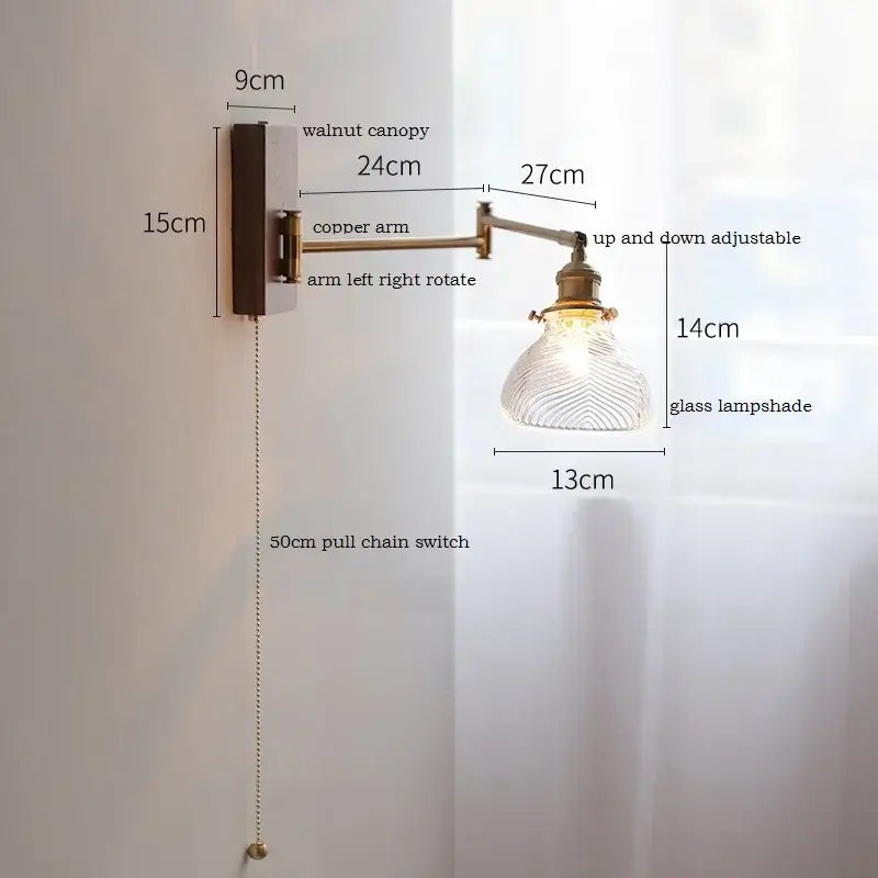 Adjustable brass wall sconce with ribbed glass shade bedroom light