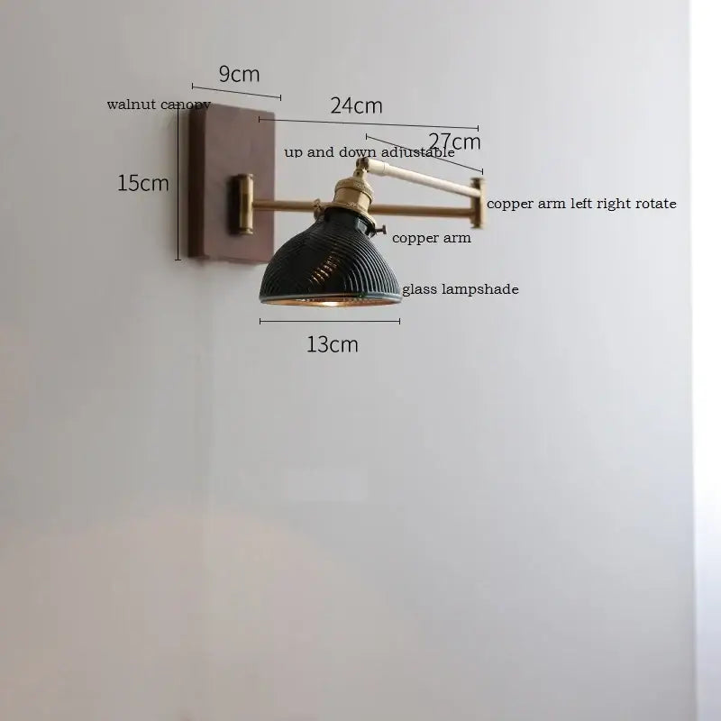 Adjustable brass wall sconce with ribbed glass shade bedroom light