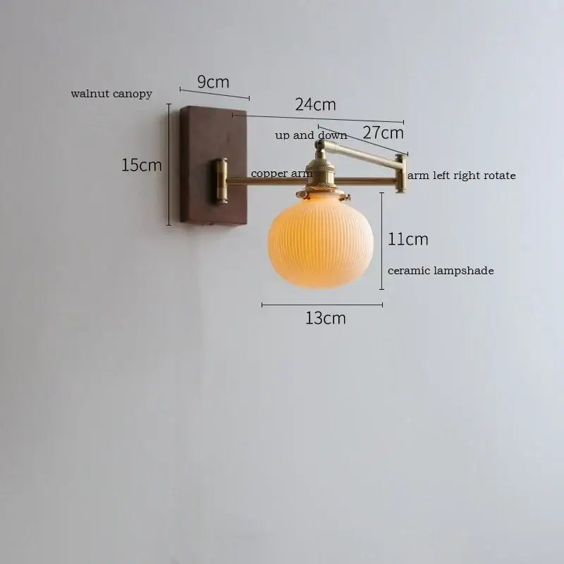 Adjustable brass wall sconce with ribbed glass shade bedroom light