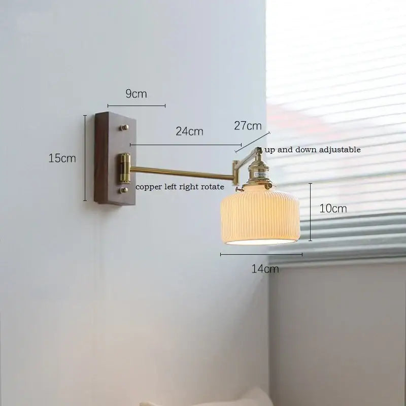 Adjustable brass wall sconce with ribbed glass shade bedroom light