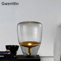 Amber glass and brass led table lamp for bedroom lighting