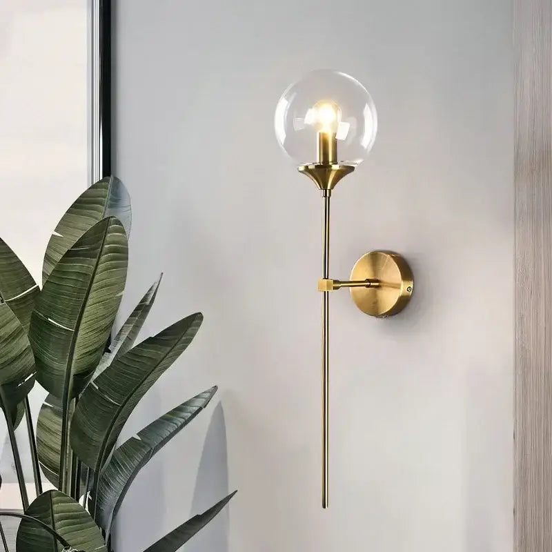 Amber glass ball sconce light brass finish bedroom wall lamp