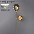 Amber glass ball sconce light brass finish bedroom wall lamp