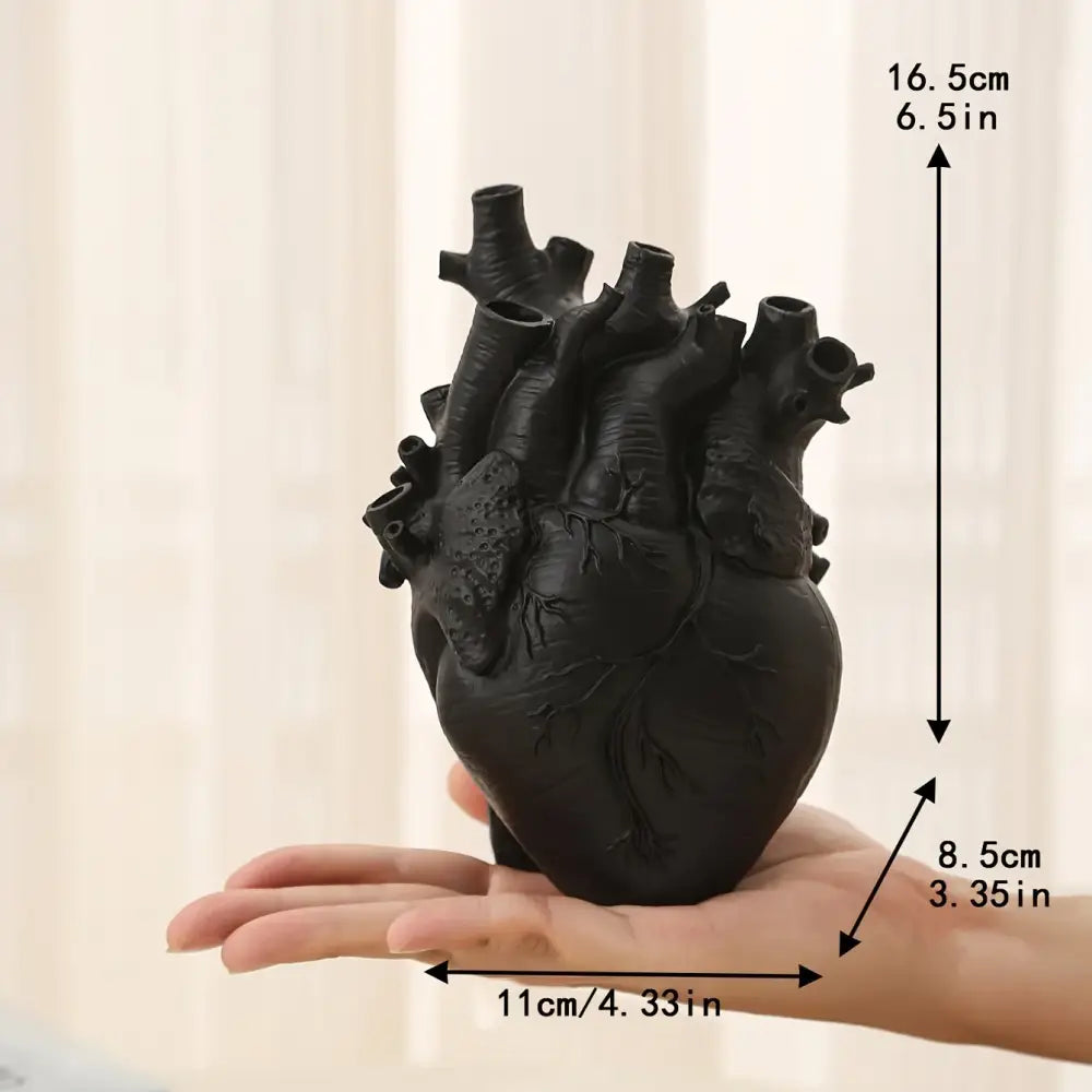 White anatomical heart vase with colorful flowers for living room
