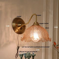 Antique brass and clear glass wall sconce bedroom light