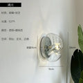 Bauhaus wavy glass wall lamp for bedroom clear and metallic light
