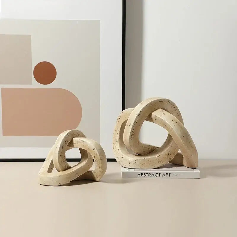 Beige speckled geometric interlocking loop knot living room sculpture