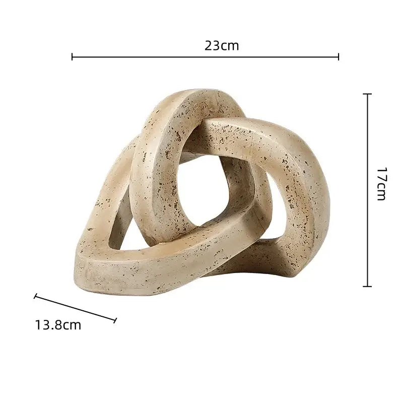 Beige speckled geometric interlocking loop knot living room sculpture