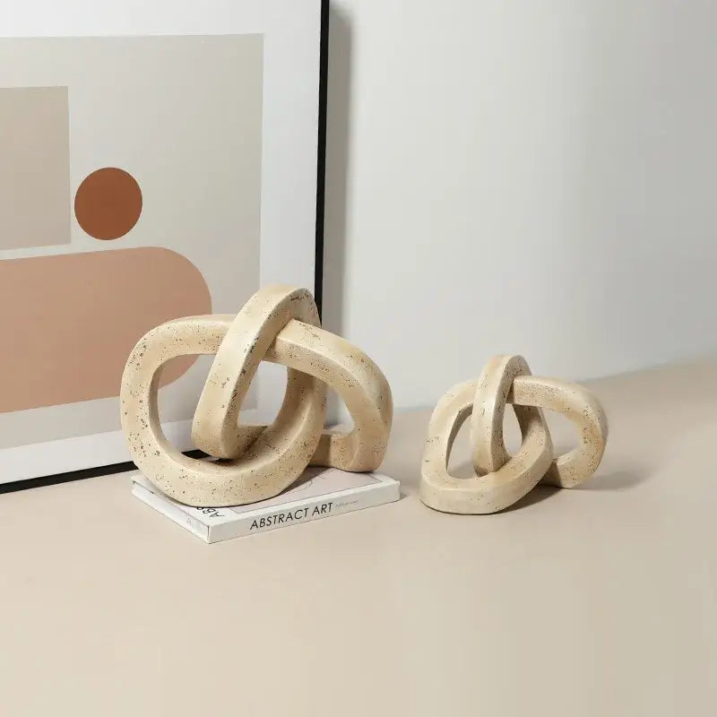 Beige speckled geometric interlocking loop knot living room sculpture
