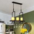 Traditional black island light fixture with wine glass holders kitchen