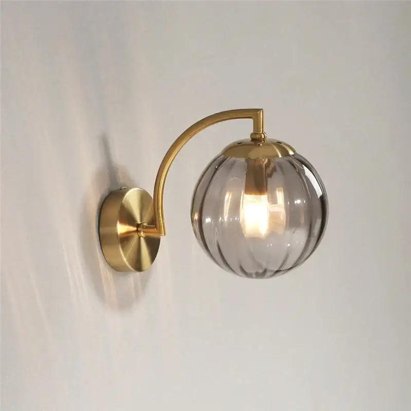 Blue and brass colored glass ball wall lamp for bedroom lighting