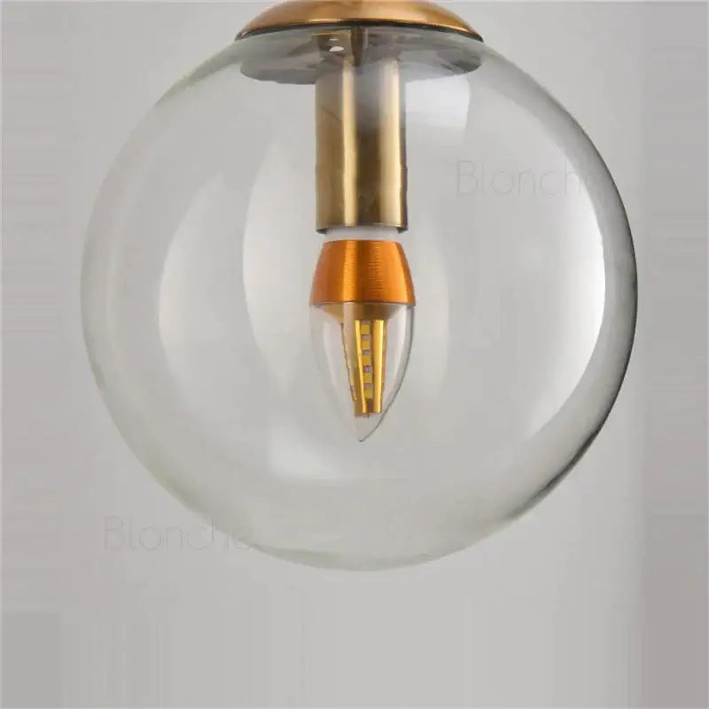 Brass amber glass ball wall light for bedroom and living room