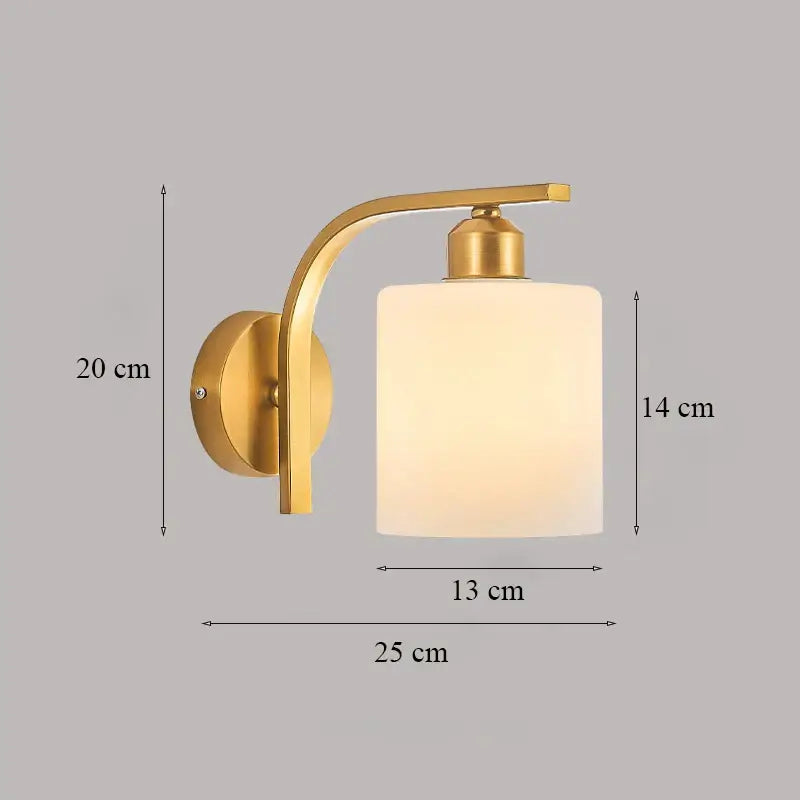 Classic brass glass wall sconce with frosted shade for bedroom