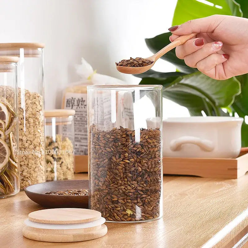 Clear glass storage jars with bamboo lids for kitchen organization