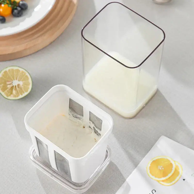 Clear greek yogurt maker with white lid and mesh filter kitchen