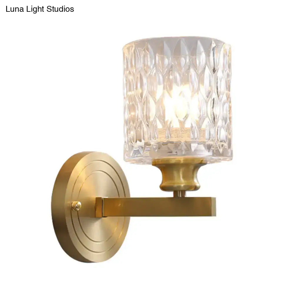 Contemporary brass cylindrical wall light bedroom faceted glass sconce