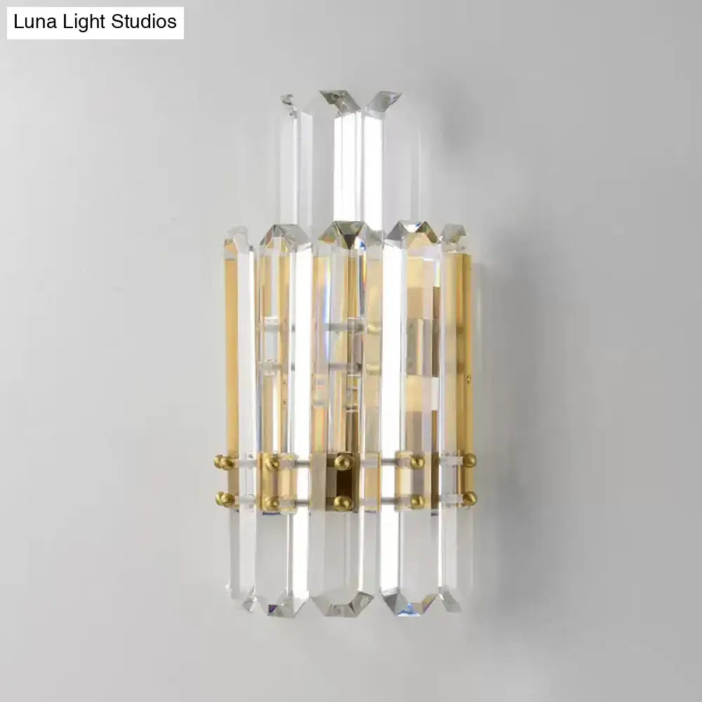 Contemporary gold wall sconce with clear crystal prisms for dining room