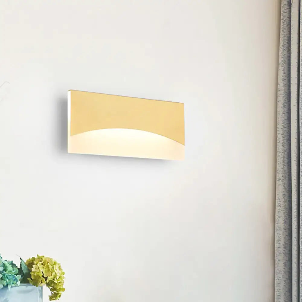 Contemporary white & gold bedroom sconce with warm color temperature
