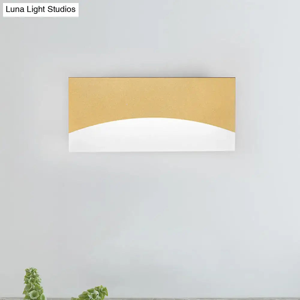 Contemporary white & gold bedroom sconce with warm color temperature