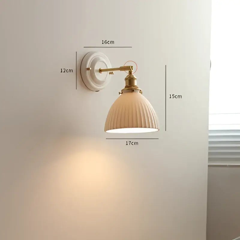 Cream ceramic led wall light with copper arm bedroom sconce