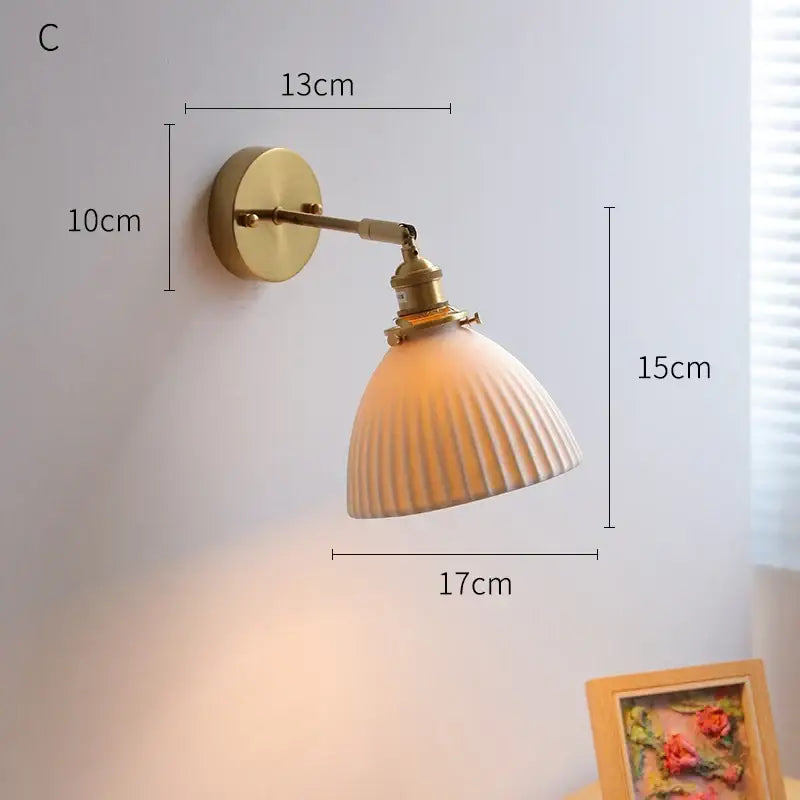 Cream ceramic led wall light with copper arm bedroom sconce