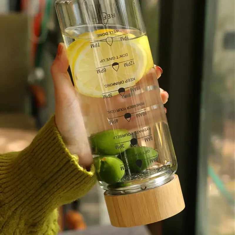 Modern glass water bottle with wood lid and tea filter kitchen accessory