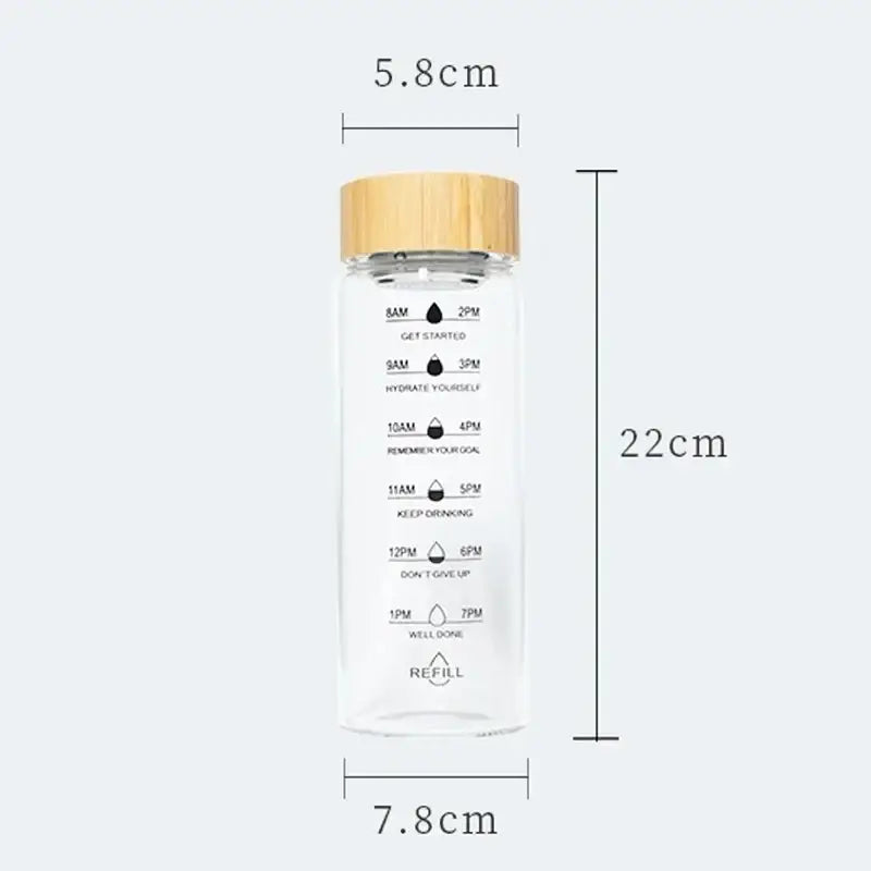 Minimalist glass water bottle with bamboo lid and kitchen time scale