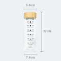 Minimalist glass water bottle with bamboo lid and kitchen time scale