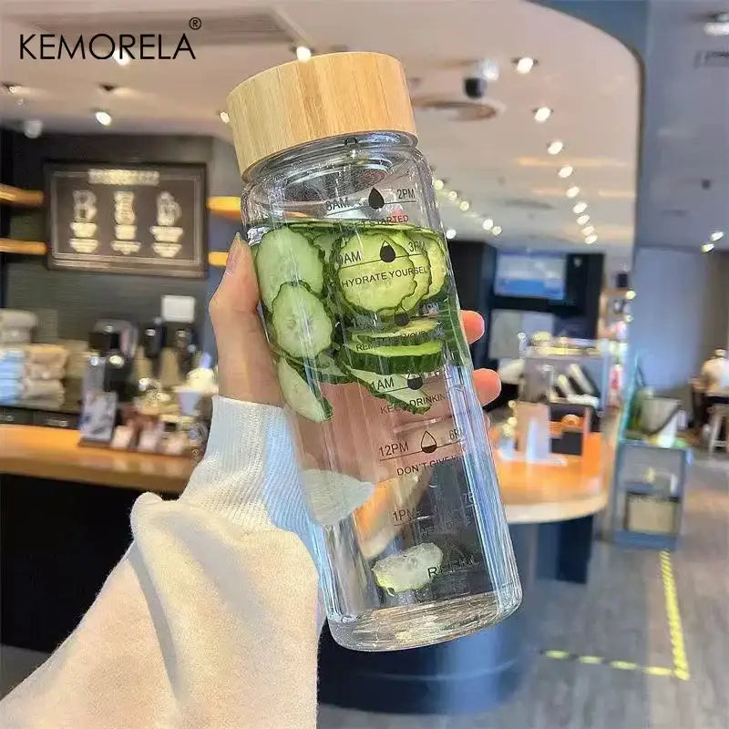 Minimalist glass water bottle with bamboo lid and kitchen time scale