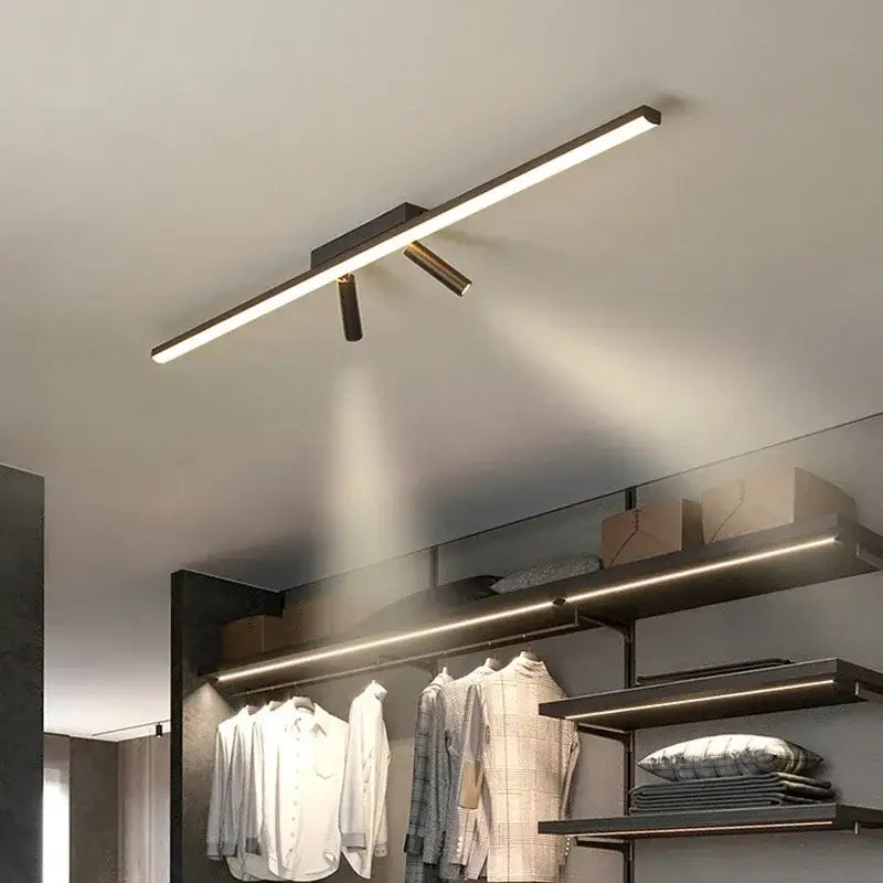 Modern minimalist black strip led chandelier with gold spotlights dining room