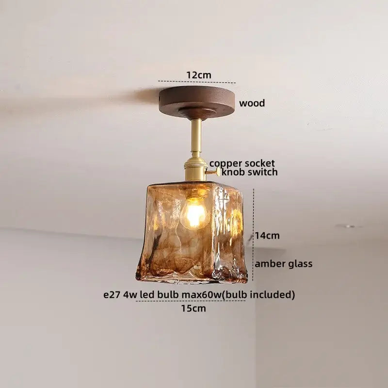 Modern amber glass and copper ceiling light fixture dining room