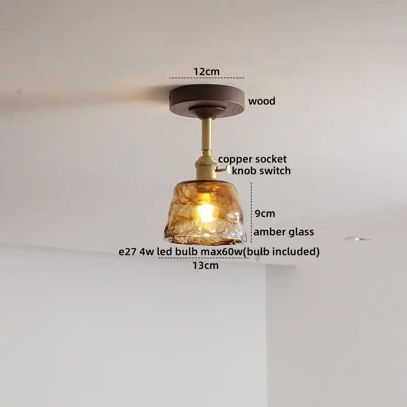 Modern amber glass and copper ceiling light fixture dining room
