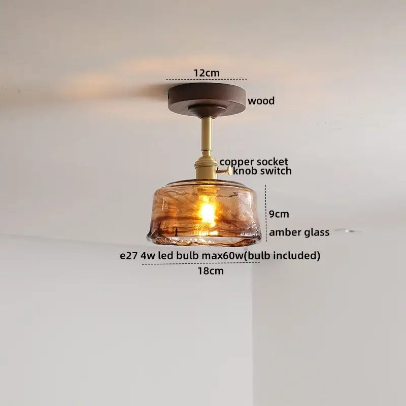 Modern amber glass and copper ceiling light fixture dining room