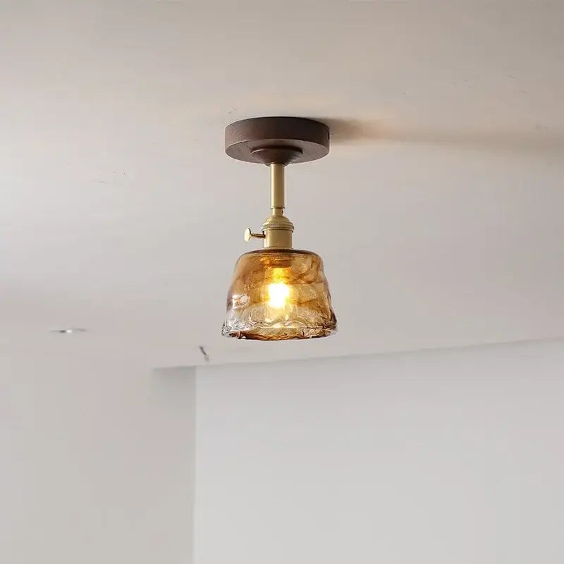 Modern amber glass and copper ceiling light fixture dining room