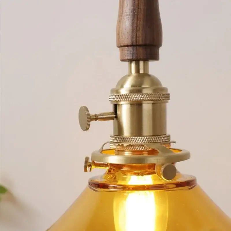 Decorbites amber glass led pendant light with walnut dining room