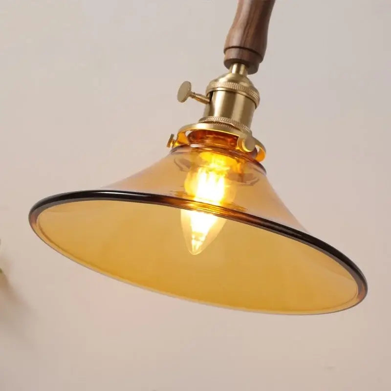 Decorbites amber glass led pendant light with walnut dining room