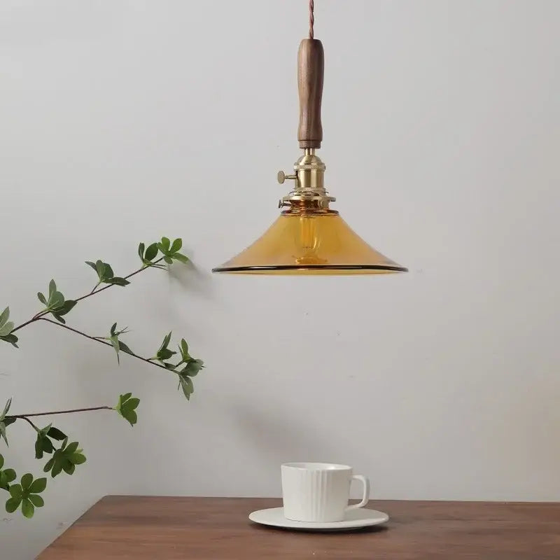 Decorbites amber glass led pendant light with walnut dining room