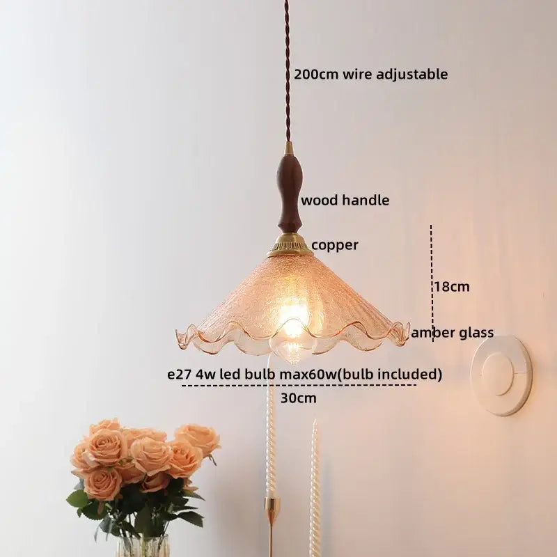 Modern amber glass pendant light with wood handle dining room