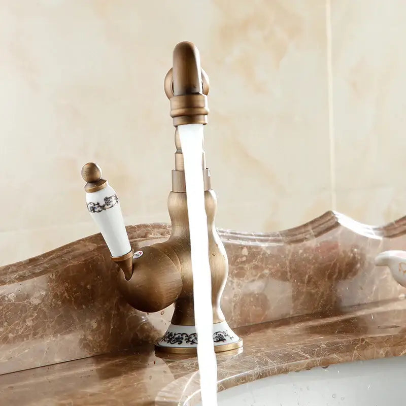 Antique brass and white ceramic bathroom sink faucet swivel spout
