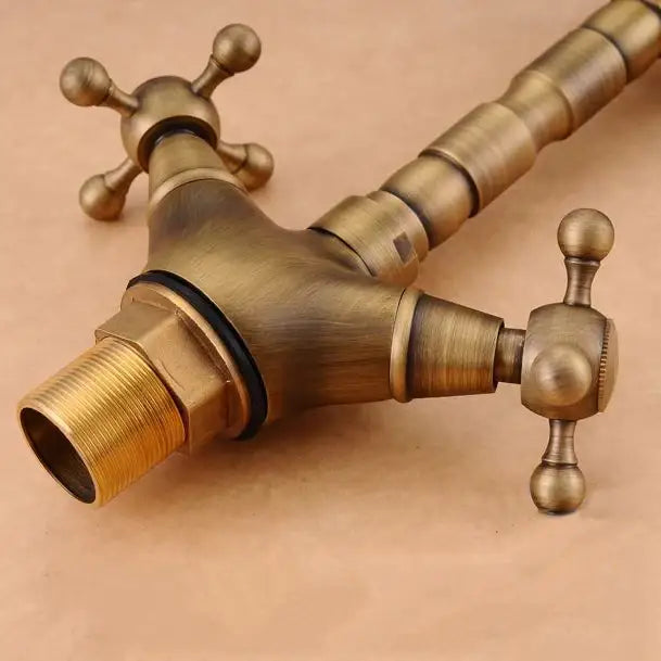 Antique brass double cross handle basin faucet kitchen swivel spout