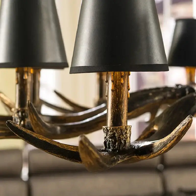 Rustic dark metallic antler chandelier with black shades dining room