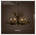 Rustic dark metallic antler chandelier with black shades dining room