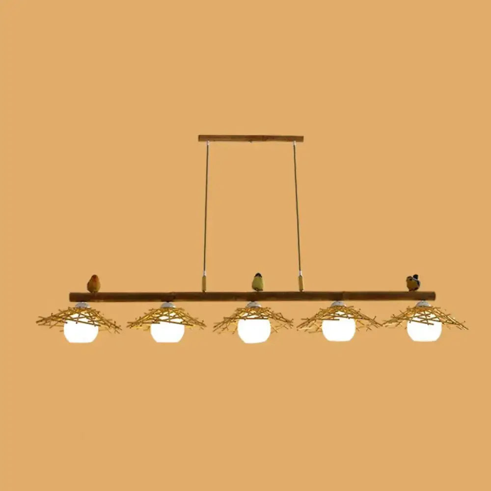 Rustic bamboo pendant with birds and white glass globe dining room