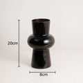 Minimalist purple & blue orchid in black glass vase living room decor